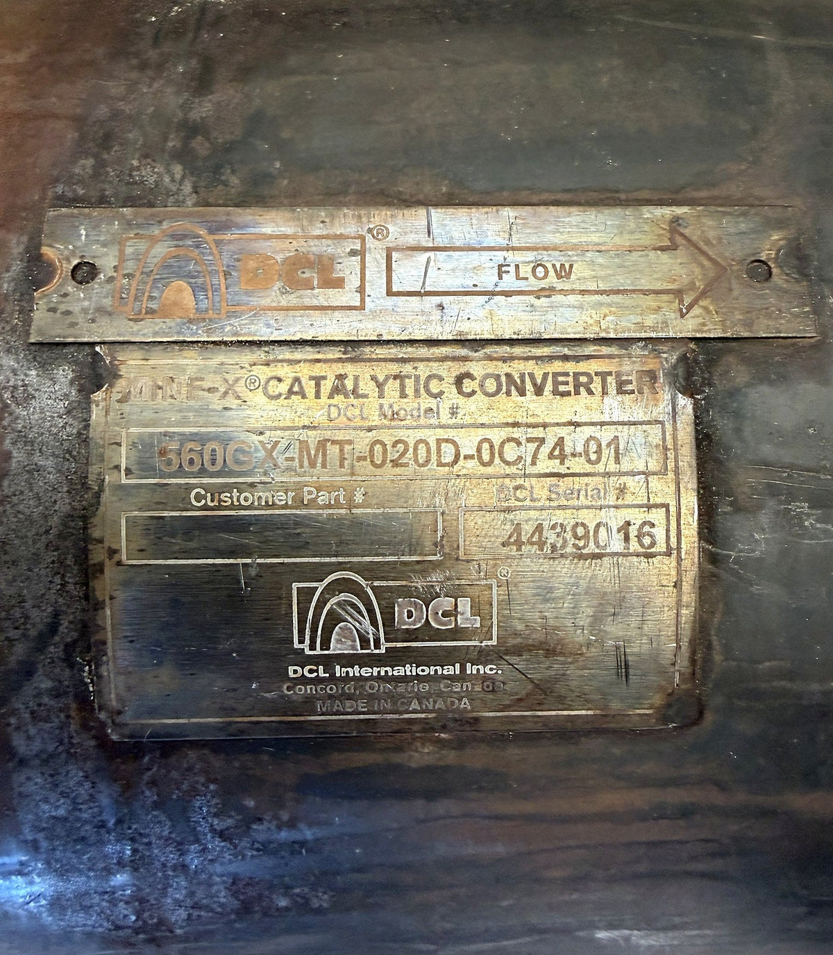 DCL Mine-X data plate showing model number, serial number and flow arrow